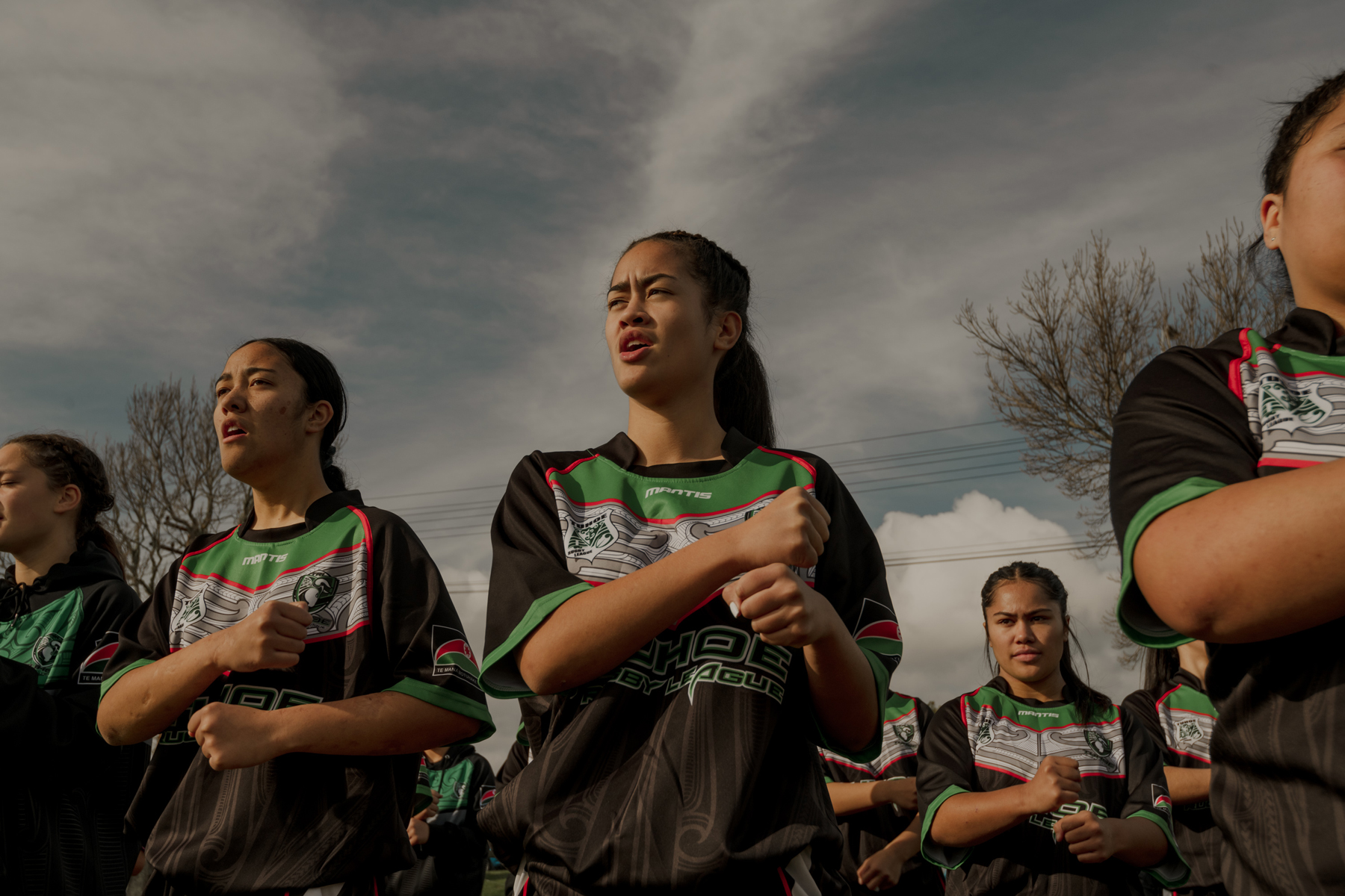 Mihiata Teepa (16) and her Tūhoe Māori Rugby League U16 teammates perform a haka during practice before a game. Rotorua, New Zealand, 12 January 2025. © Tatsiana Chypsanava, Pulitzer Center for New Zealand Geographic