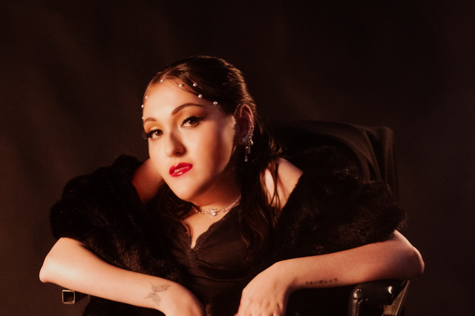 Singer songwriter Nat Luna was slated to appear at Music SA's Scouted event in August, only to be withdrawn from the lineup over accessibility failures. Photo: Lucinda Corin / Supplied