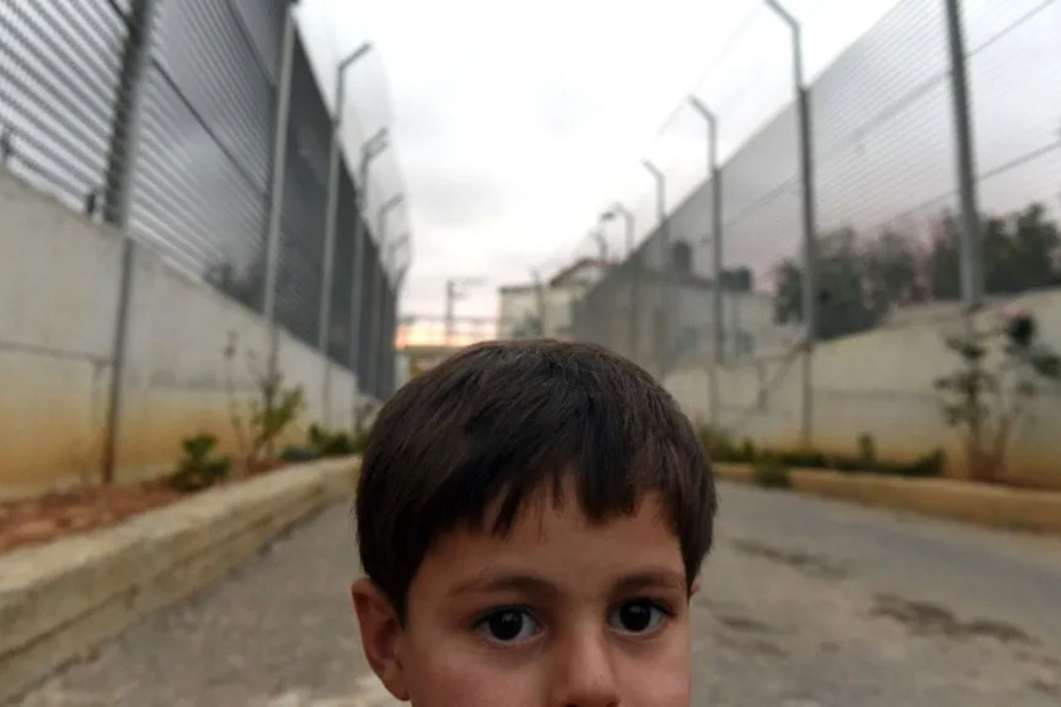A child in the space between the Jewish settlement of Givon Hahadasha and the West Bank village of Beit Ijza, north of Jerusalem.