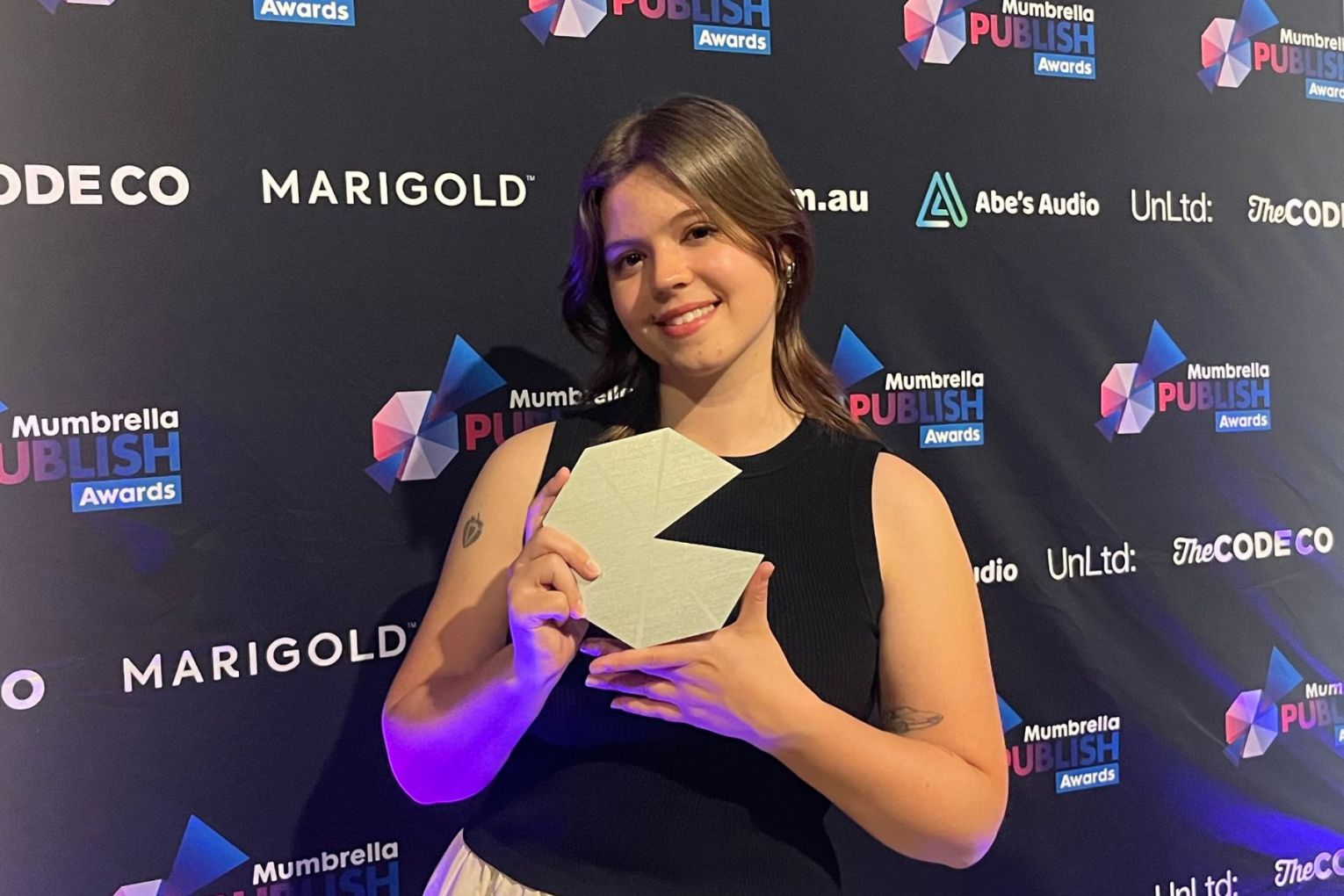 CityMag's lead graphic designer Jayde Vandborg after accepting the Magazine Cover of the Year award. This picture: Helen Karakulak 