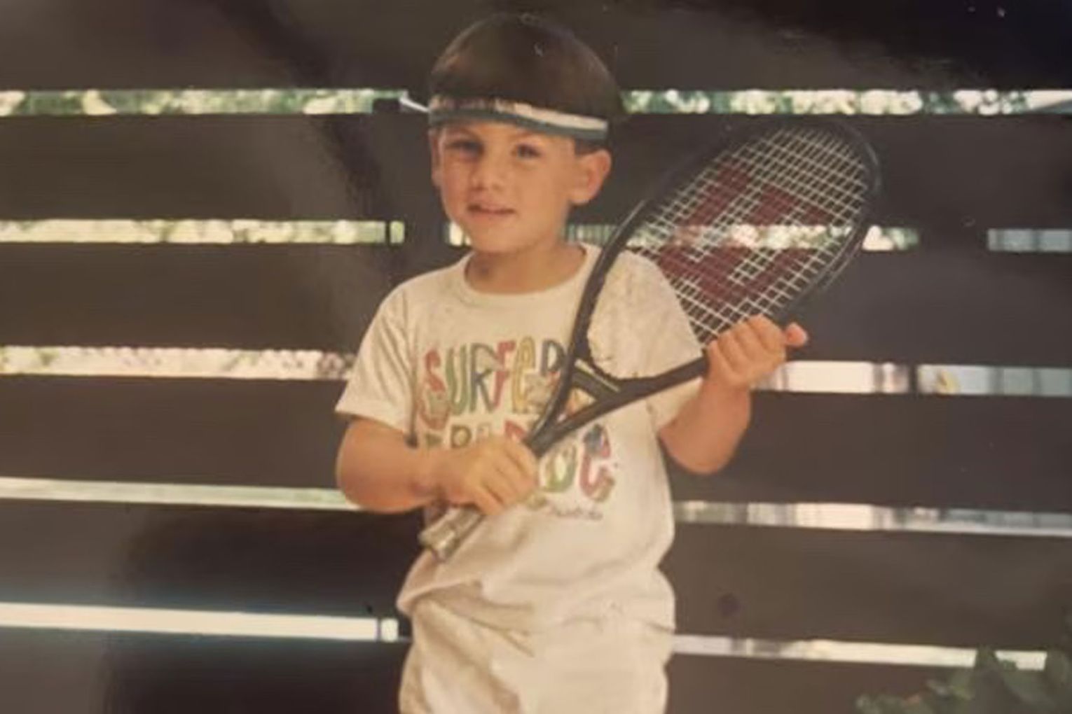 A young Todd Ley with his first tennis racket