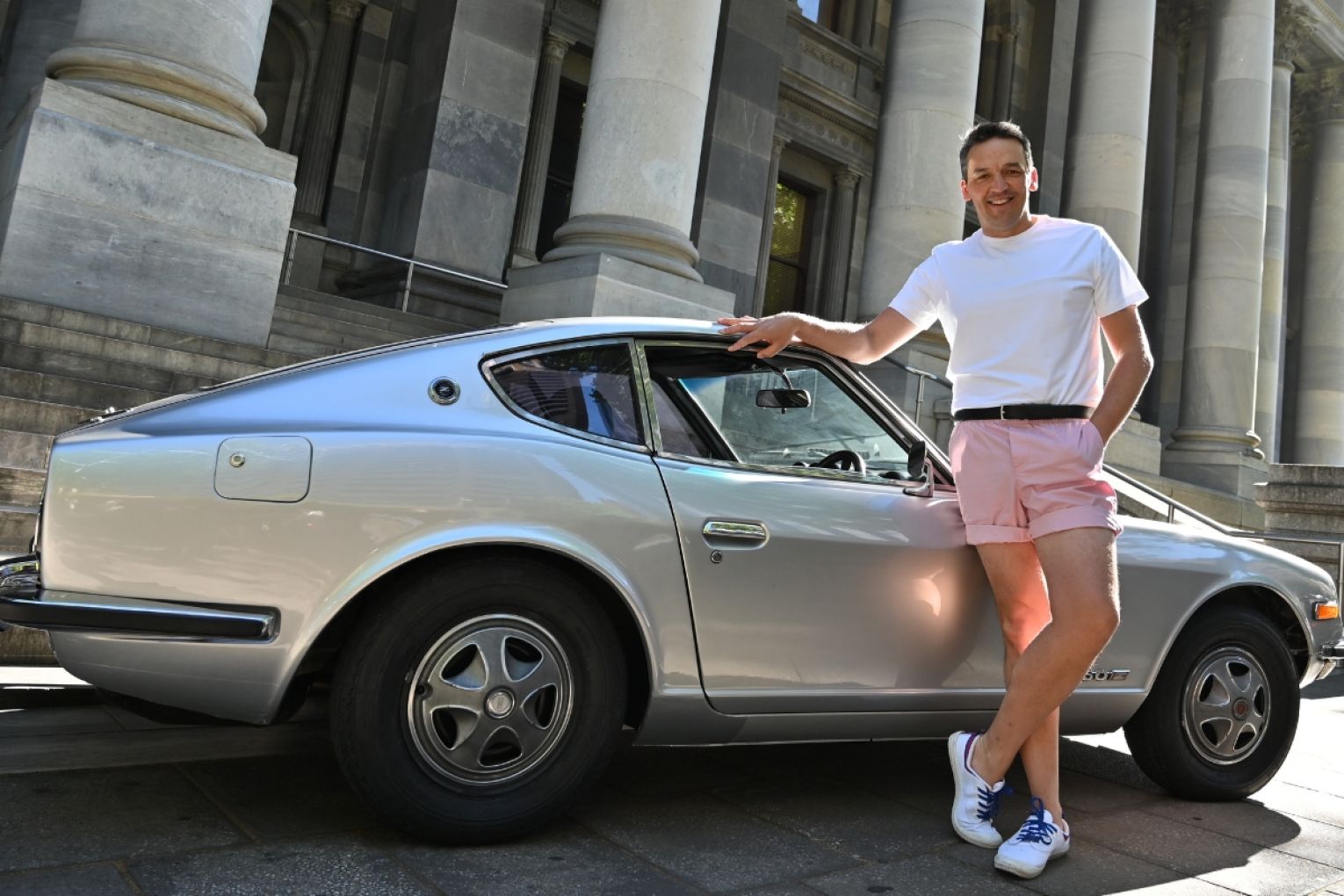 Police and Education Minister Blair Boyer is driving former premier Don Dunstan's old sports car in the Bay to Birdwood. He has donned replica pink shorts for the drive. Photo: Belinda Willis