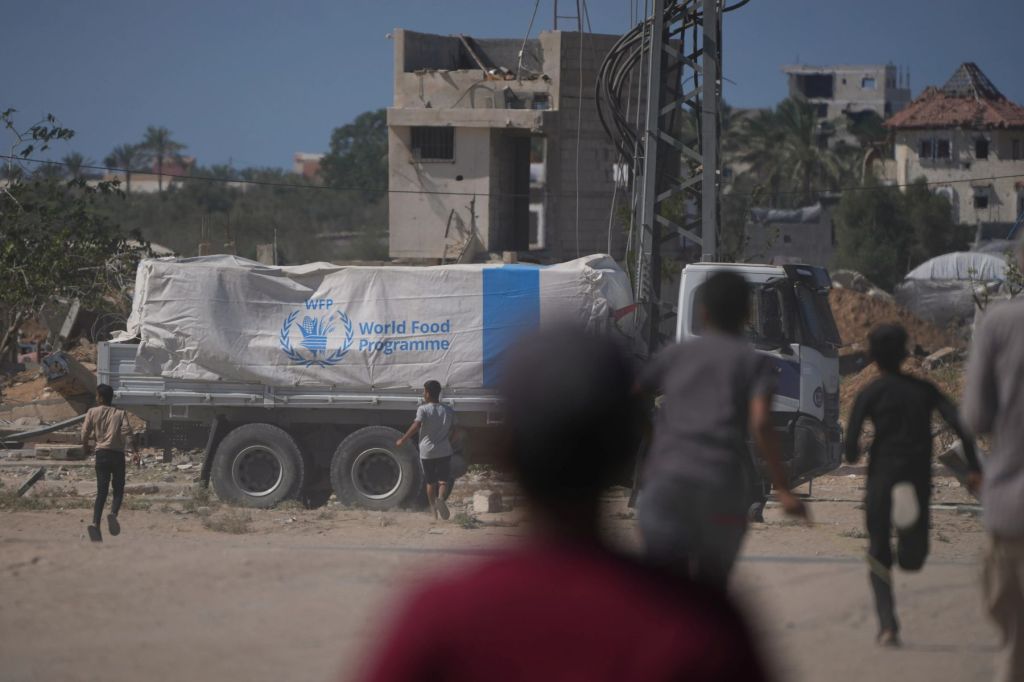Aid trucks roll into Gaza as Hamas hands over more bodies
