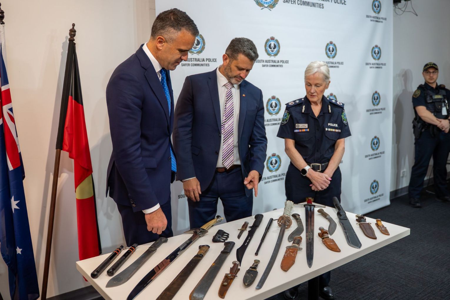 Premier Peter Malianuskas and Deputy Premier Kyam Maher inspect surrendered knives. Photo: Supplied
