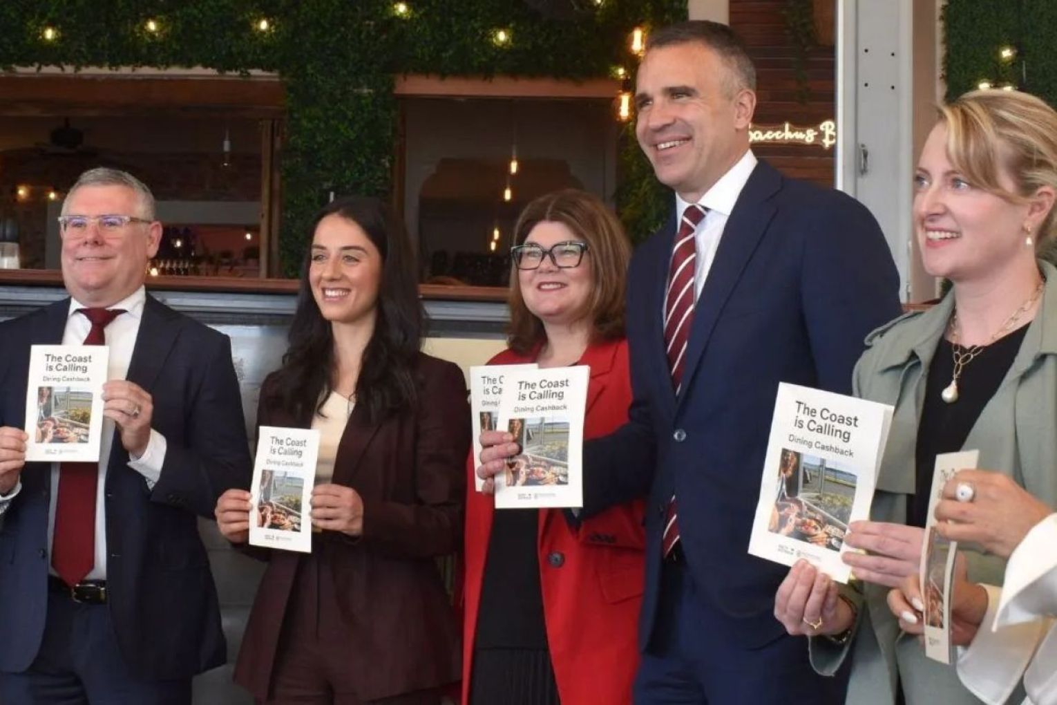 The Premier, Environment Minister Lucy Hood, Tourism Minister Zoe Bettison, Federal Environment Minister Murray Watt, and candidate for Colton joined the owner of Bacchus Bar for today's announcement. Picture: Helen Karakulak/InDaily