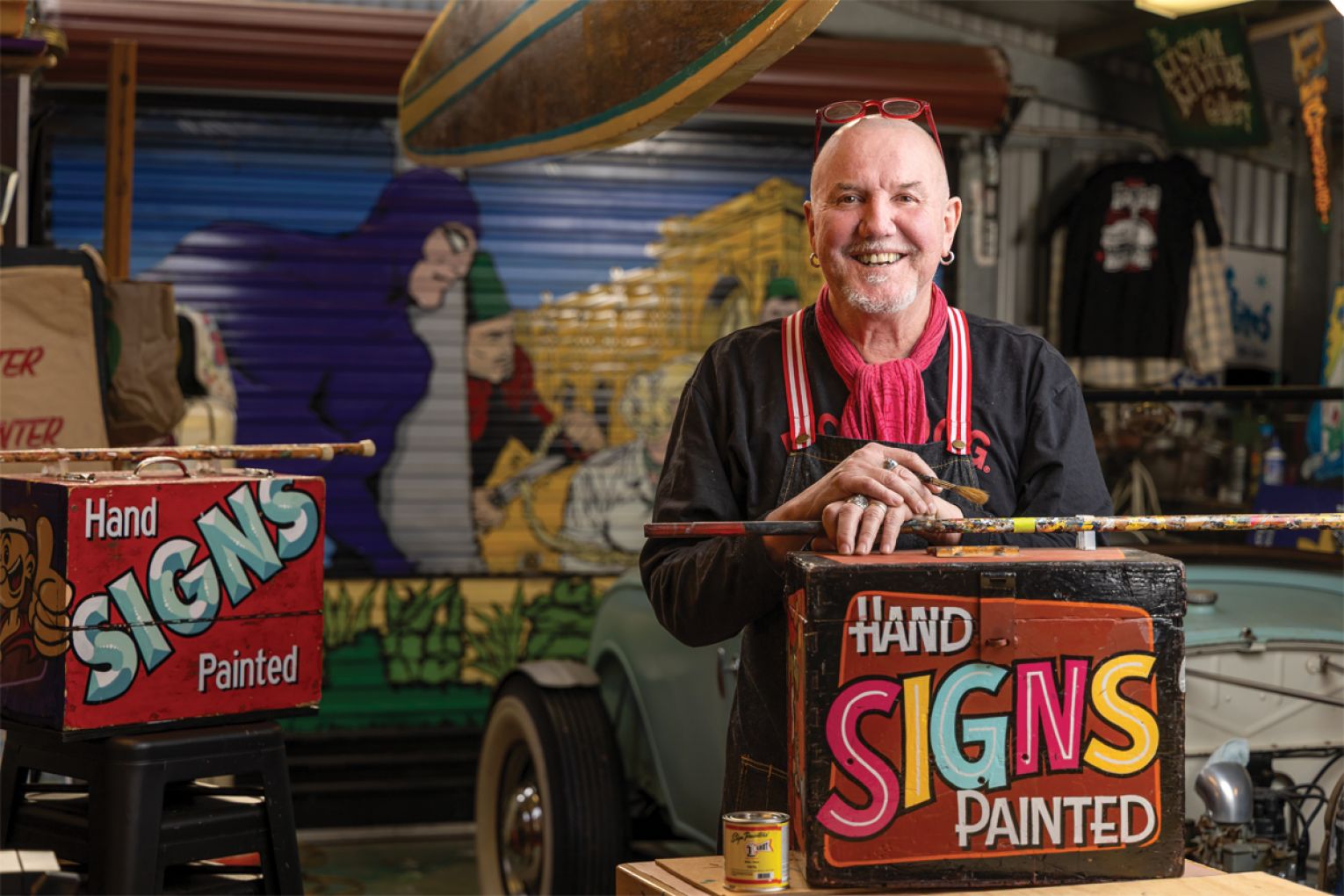 Ray in his shed where he hosts occasional signwriting workshops.
