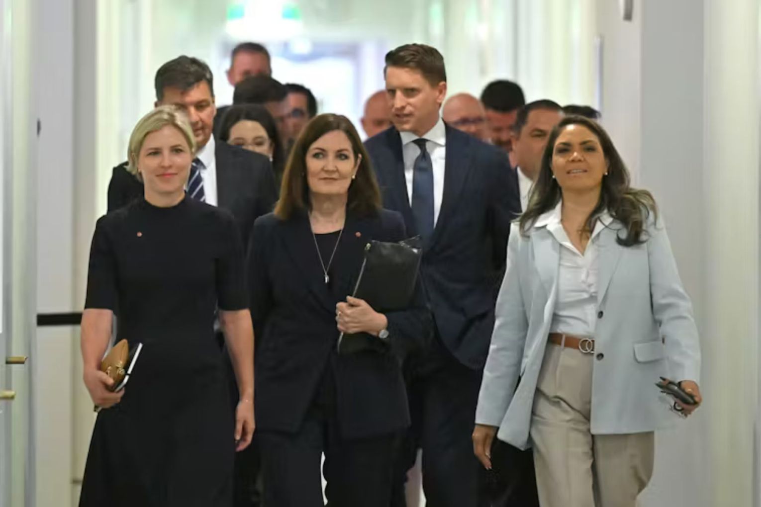 Liberals Jessica Collins, Sarah Henderson, Jacinta Nampijinpa Price, Angus Taylor, and Andrew Hastie heading a group of conservative Liberals before a party room meeting. Picture: Mick Tsikas/AAP