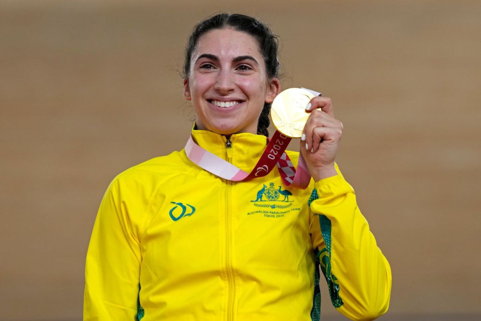 Champion cyclist Paige Greco with her gold medal at the Paralympics in Tokyo in 2021. Photo: Shuji Kajiyama/AAP