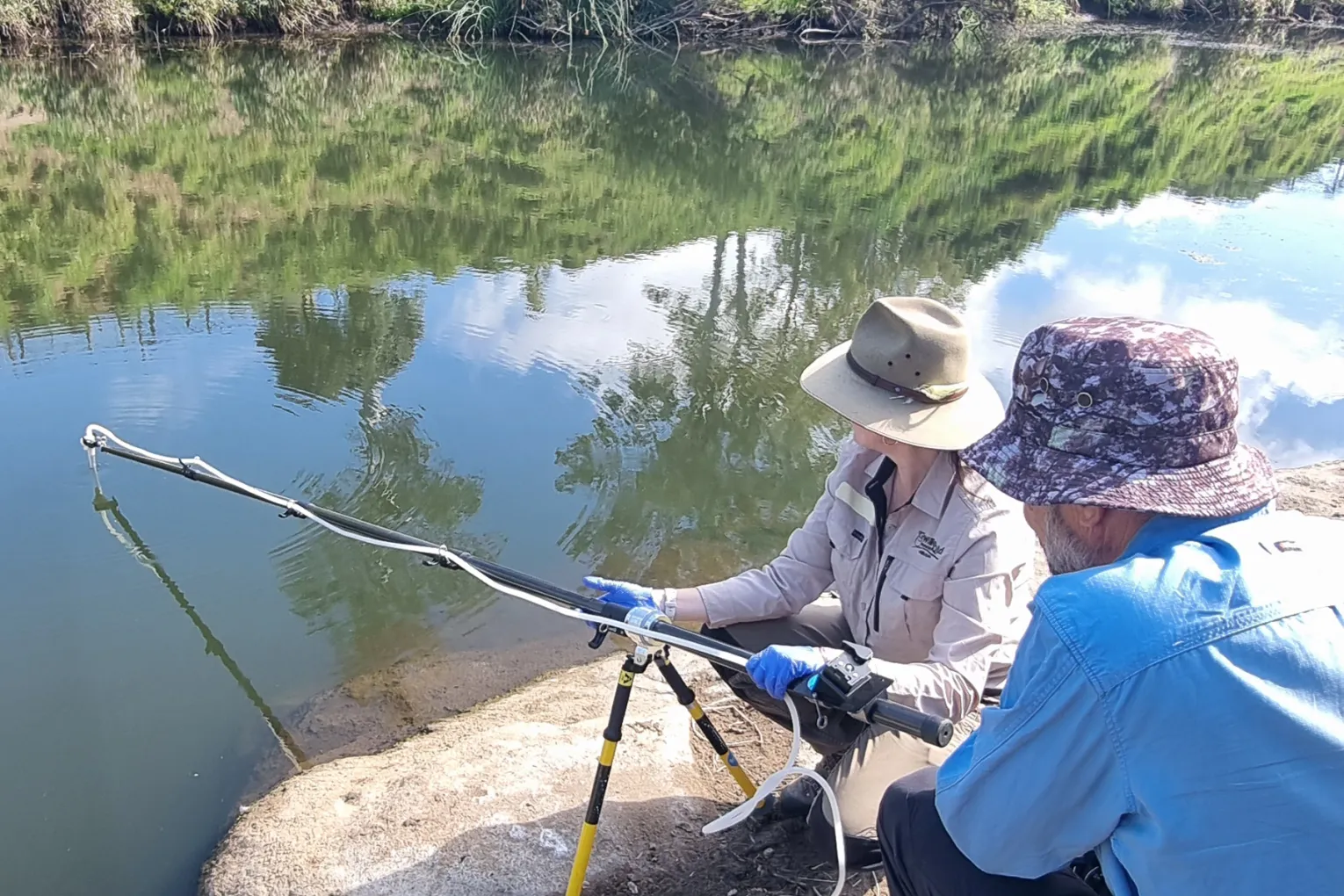 Dr Tamielle Brunt, Wildlife Queensland’s PlatypusWatch Project Officer and Chris Hoffmann, LVRC Catchment Coordinator, collecting eDNA samples in Lockyer Creek. Credit: Lockyer Valley Regional Council