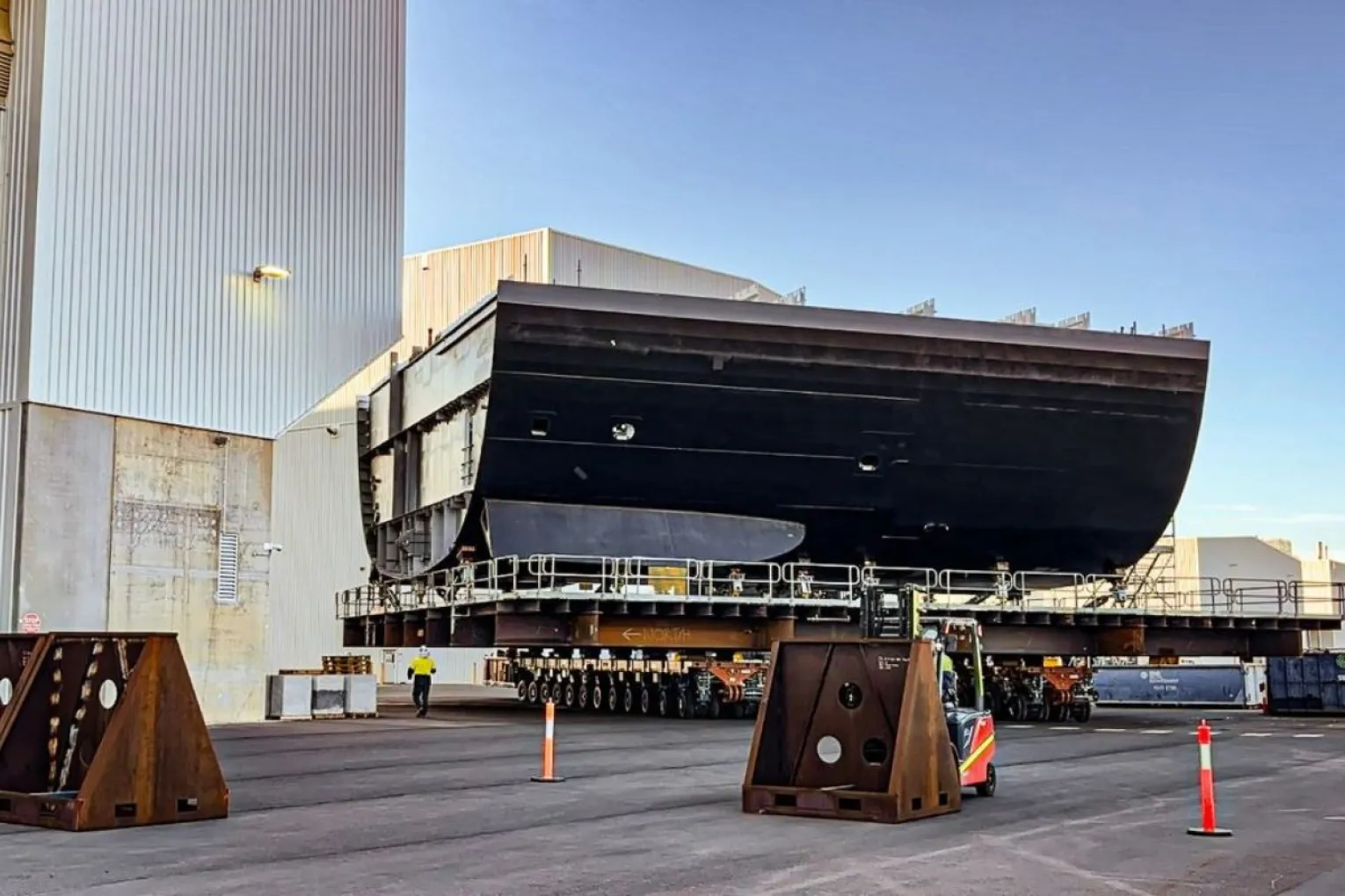 A piece of the Hunter Class frigates emerges from a warehouse at Osborne. Photo: BAE Systems