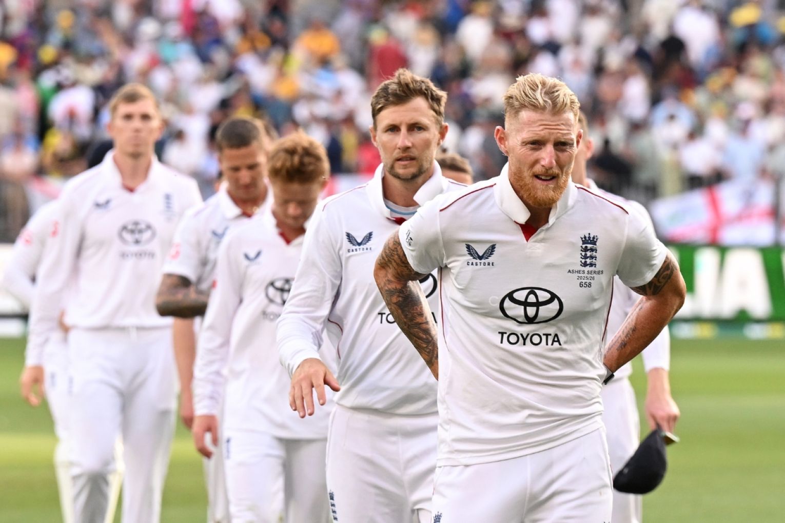 The England team led by captain Ben Stokes leaves the field following their eight-wicket defeat on Day Two of the First Ashes Test between Australia and England at Perth Stadium in Nobember. Picture: AAP Image/Dave Hunt 