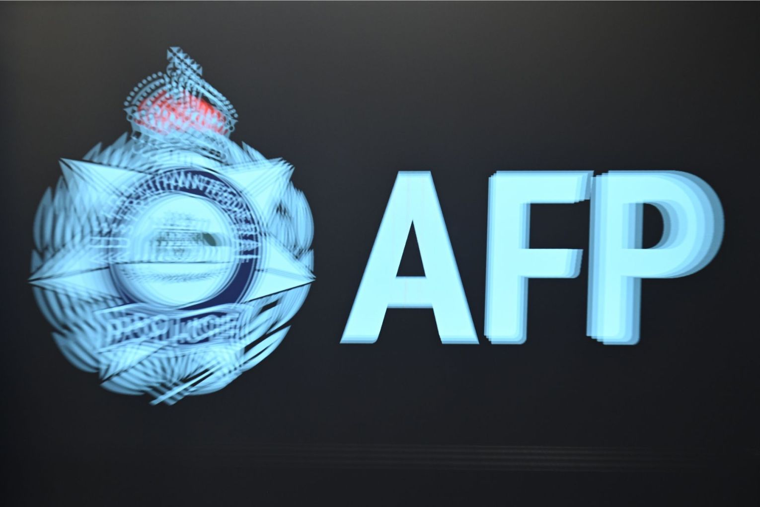 The AFP has charged three people with displaying a prohibited Nazi symbol. Photo: Lukas Coch/AAP.