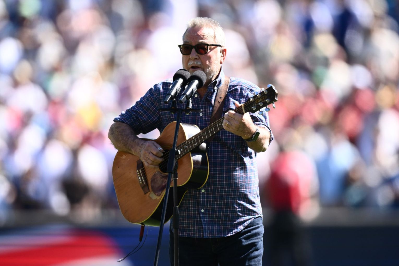John Williamson plays his iconic song 'True Blue' ahead of the third Ashes Test in Adelaide. Picture: Joel Carrett/AAP.