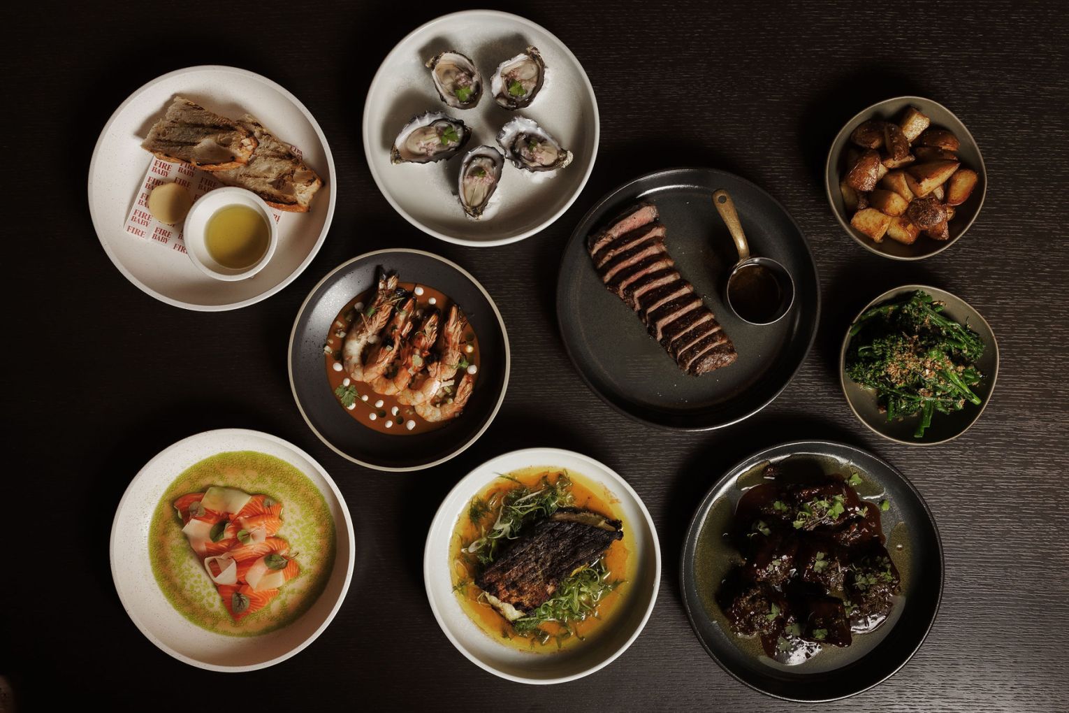 A spread of flame-licked fare at Ember at Fire Baby, image credit: Mathilde Bouby