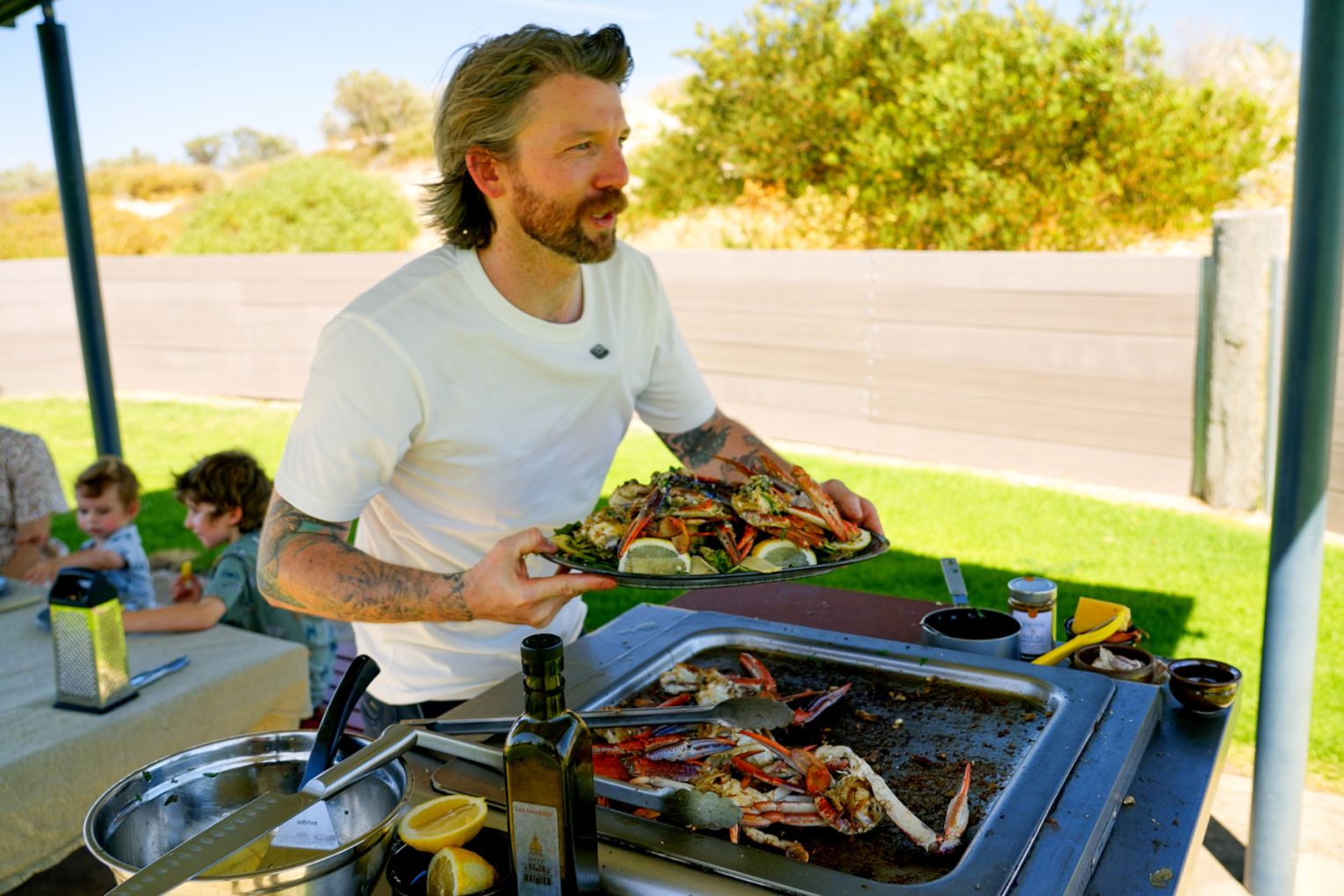 Phil Donnelly is encouraging people to come back to the coast with his cooking show filmed from park barbecues. Image: supplied.