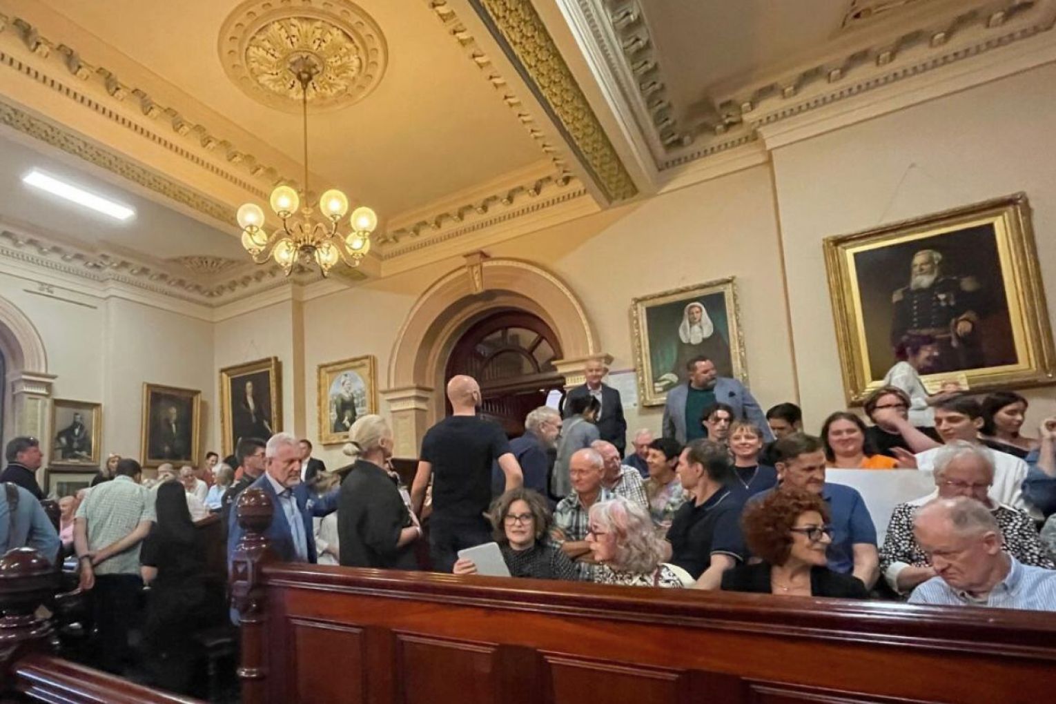 A crowd gathered in Town Hall to see the decision for a new-look Hutt Street. Photo: InDaily