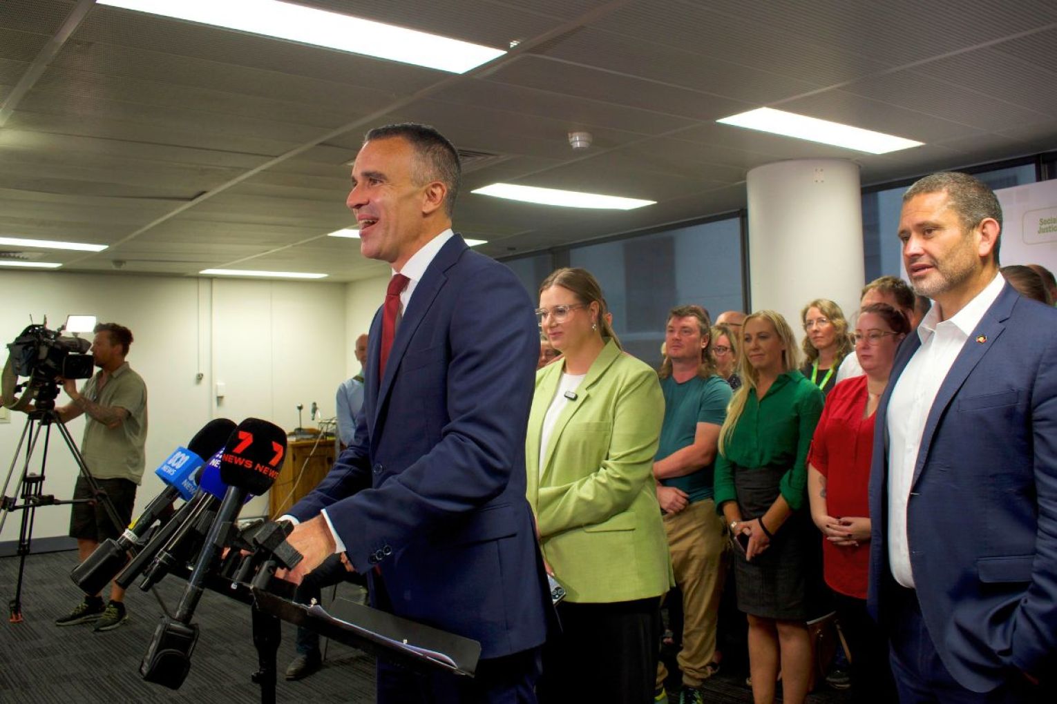 Premier Peter Malinauskas, Deputy Premier Kyam Maher and union boss Charlotte Watson announced their plan to support the lowest paid workers on Thursday. Photos: Helen Karakulak/InDaily