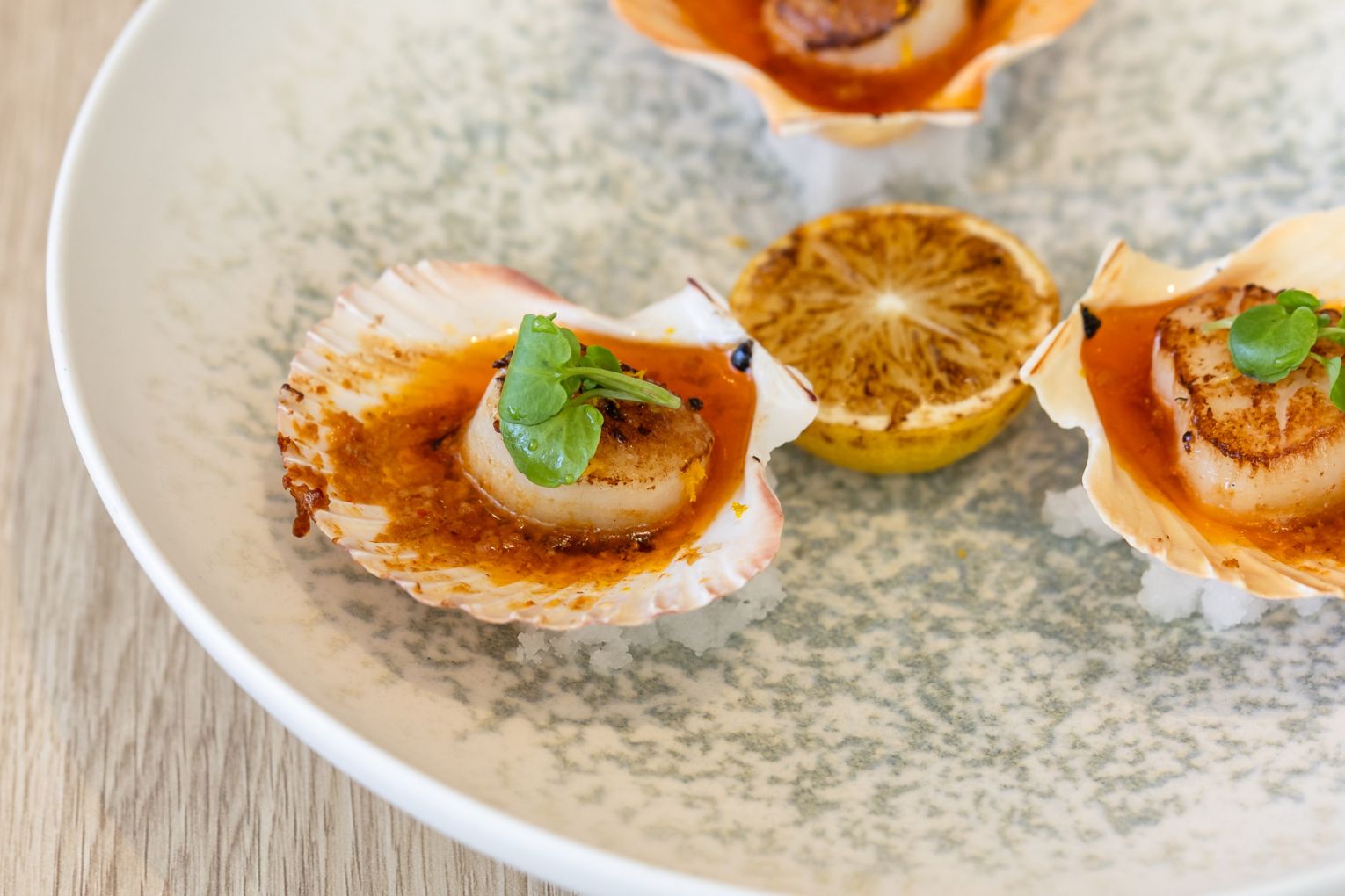 Scallops baked with chilli butter at Oro by Sogno Italiano in Broadbeach, image credit: Jade Quinlivan
