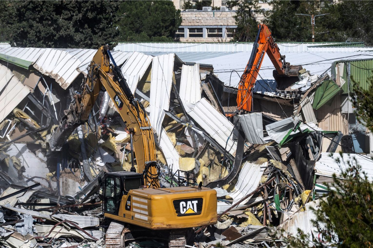 Bulldozers are demolishing the headquarters of the UN Relief and Works Agency in East Jerusalem.