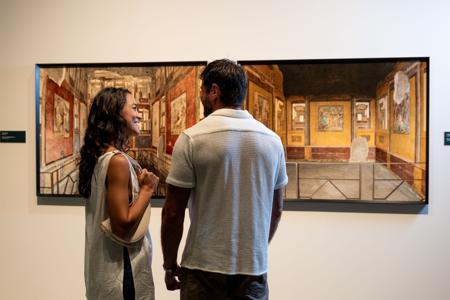Visitors to HOTA (Home of the Arts) at Surfers Paradise browse the amazing photos featured in the exhibition Inside Pompeii: Origins of a European Way of Life. 