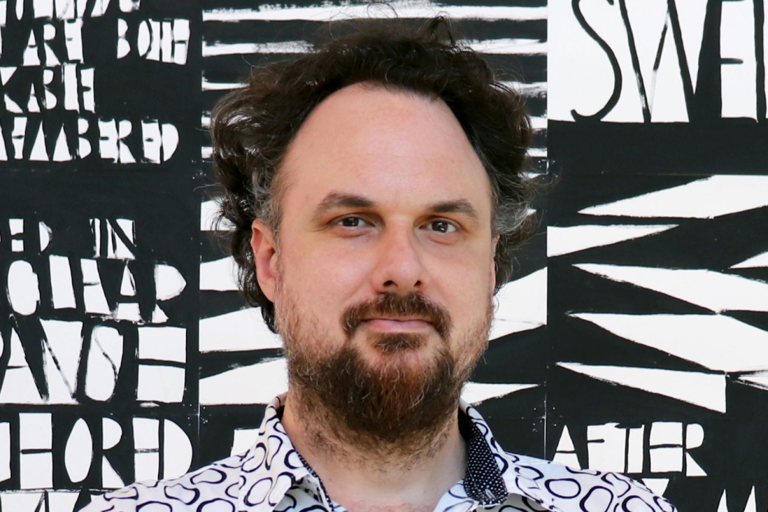 Jonathan McBurnie is director of the Rockhampton Museum of Art and chief judge for this year's Brisbane Portrait Prize.