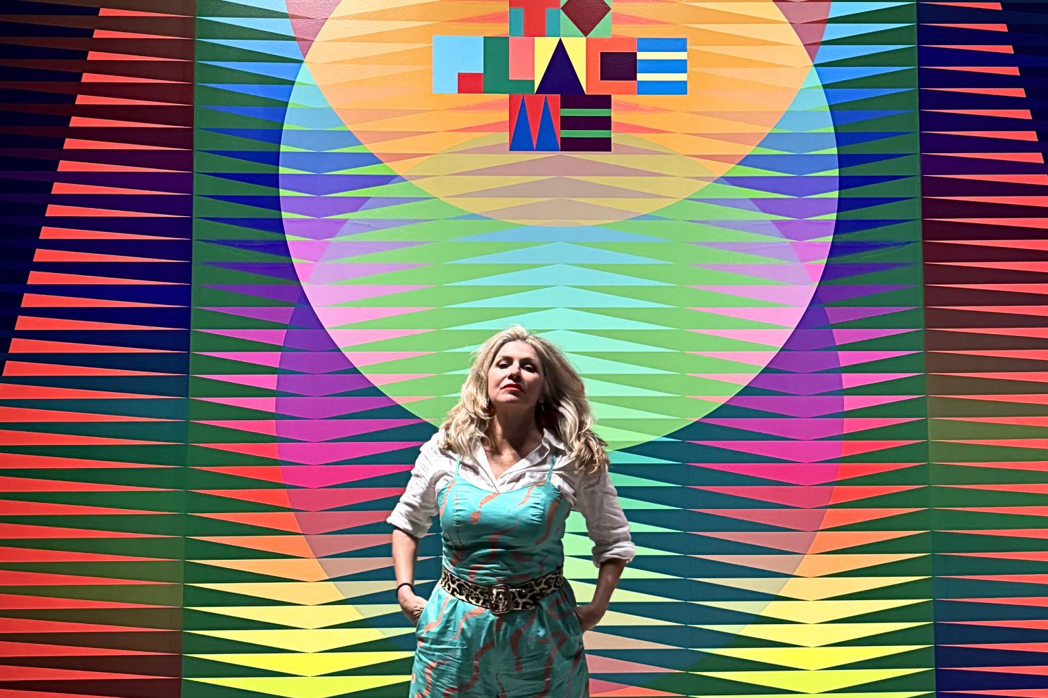 Rebecca McIntosh (aka Bec Mac) standing in front of a Jeffery Gibson painting at The Broad in LA, while on her Churchill Fellowship. 