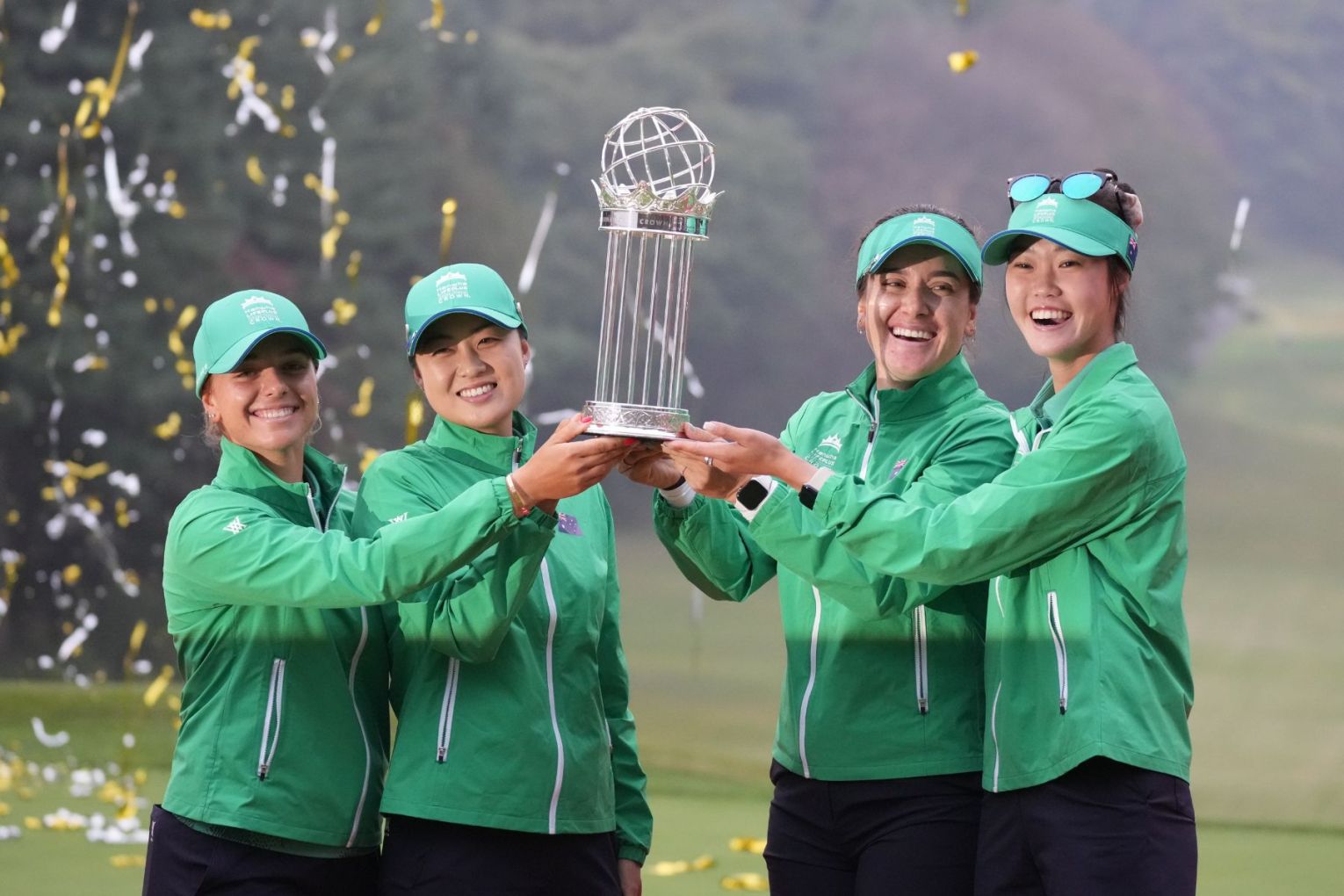 Steph Kyriacou, Minjee Lee, Hannah Green and Grace Kim lift the International Crown trophy. Picture: AP PHOTO
