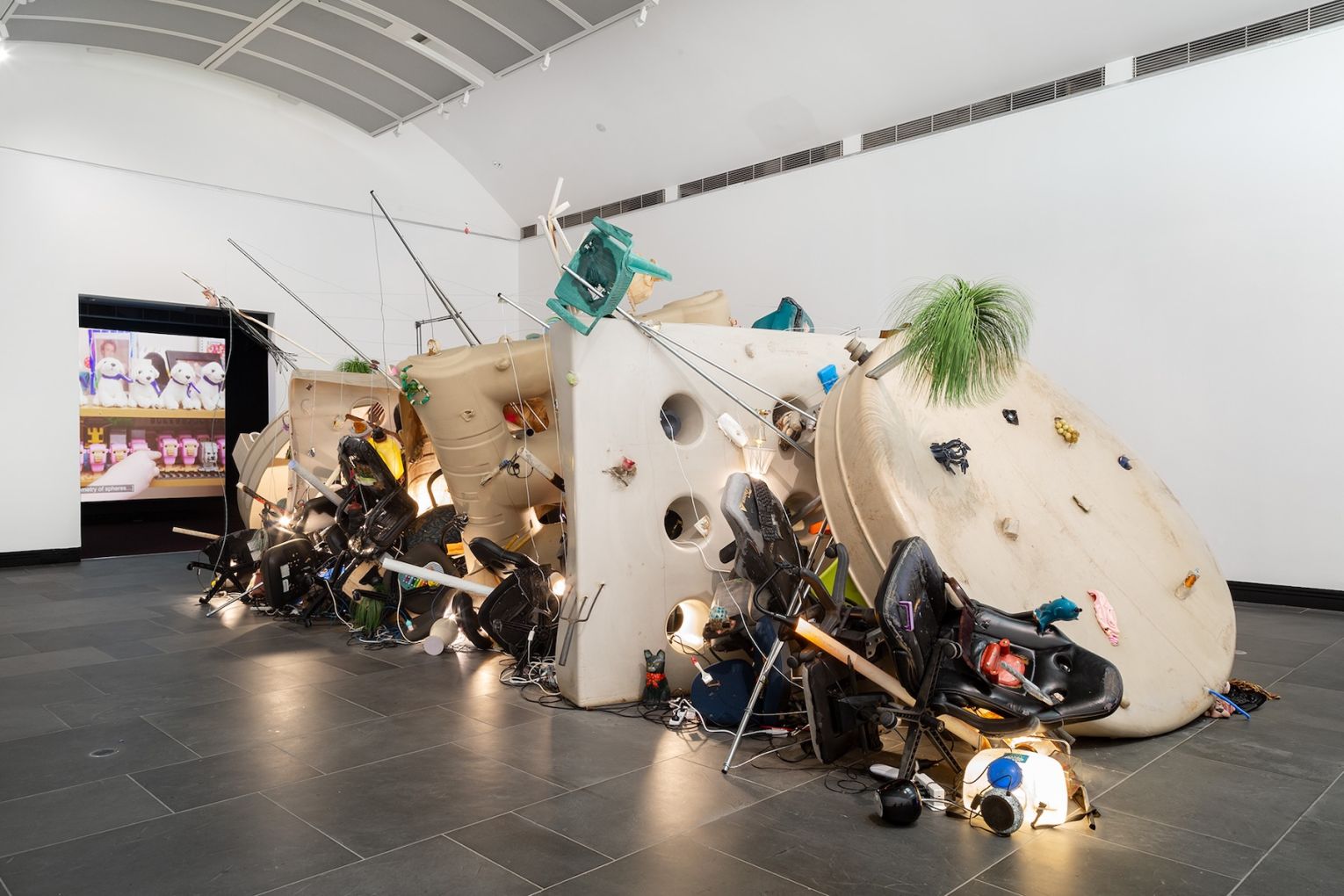 Installation view: 2026 Adelaide Biennial of
Australian Art: Yield Strength, featuring
Necrorealist Sunscreen by Erika Scott and
Pocket Money by Emmaline Zanelli, Art
Gallery of South Australia, Adelaide. Photo: Saul Steed