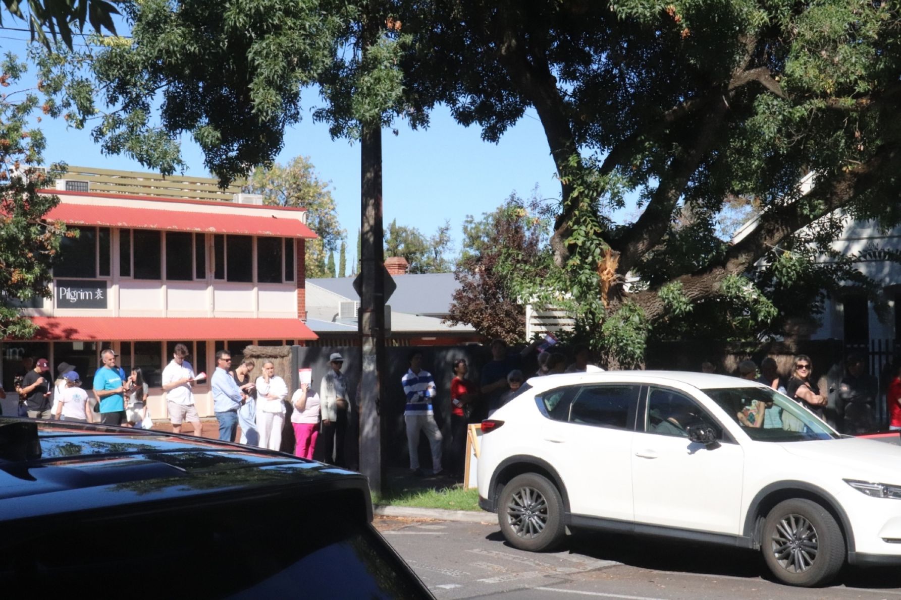Voters waiting in line at St Peter Claver Church Hall in Dulwich. Photo: Charlie Gilchrist/InDaily