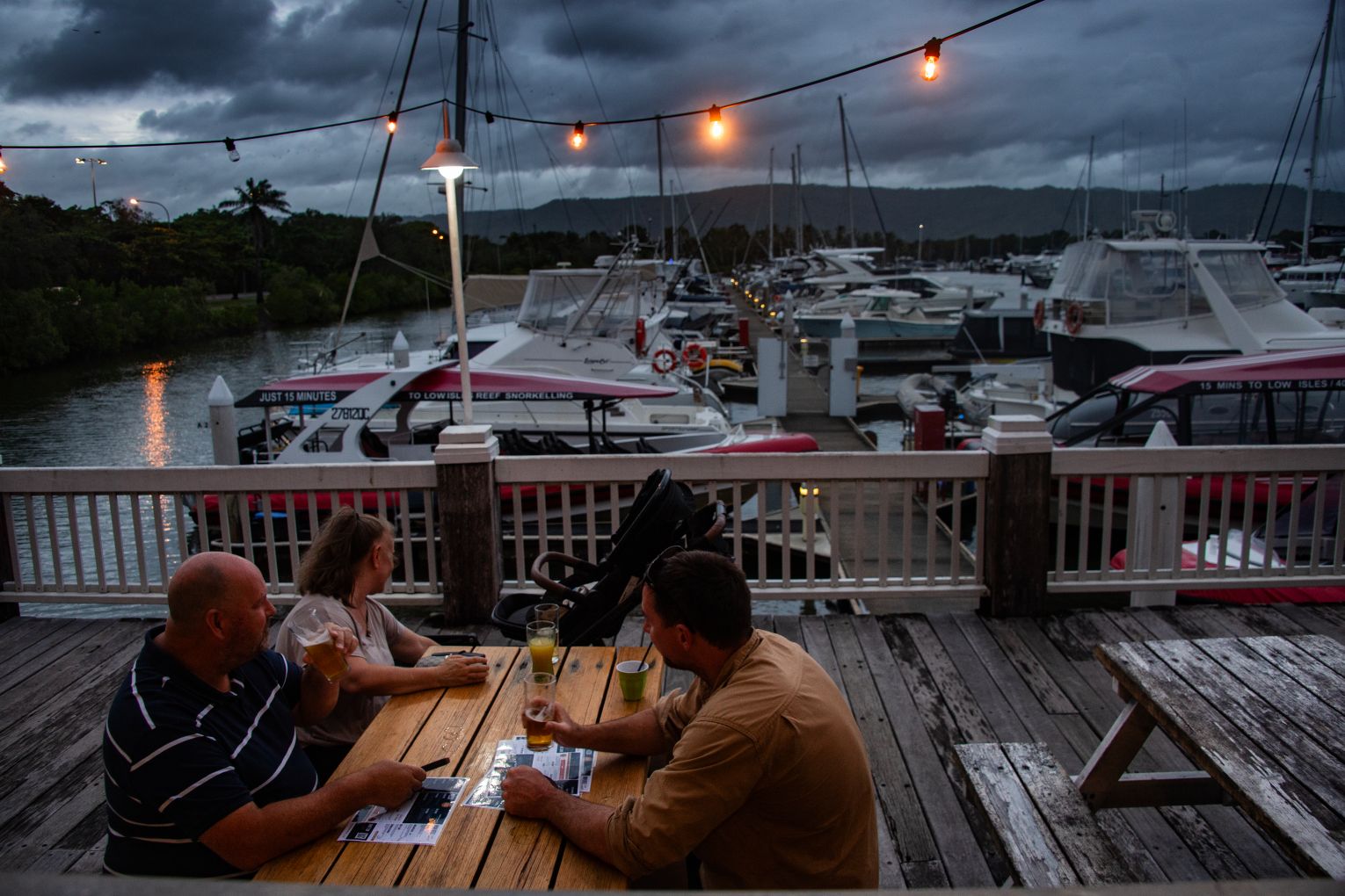 Patrons at the Wharf ahead of the expected arrival of Cyclone Narelle, Port Douglas, Queensland on Thursday, March 19, 2026. The cyclone made landfall on Friday. Picture: AAP Image/Brian Cassey
