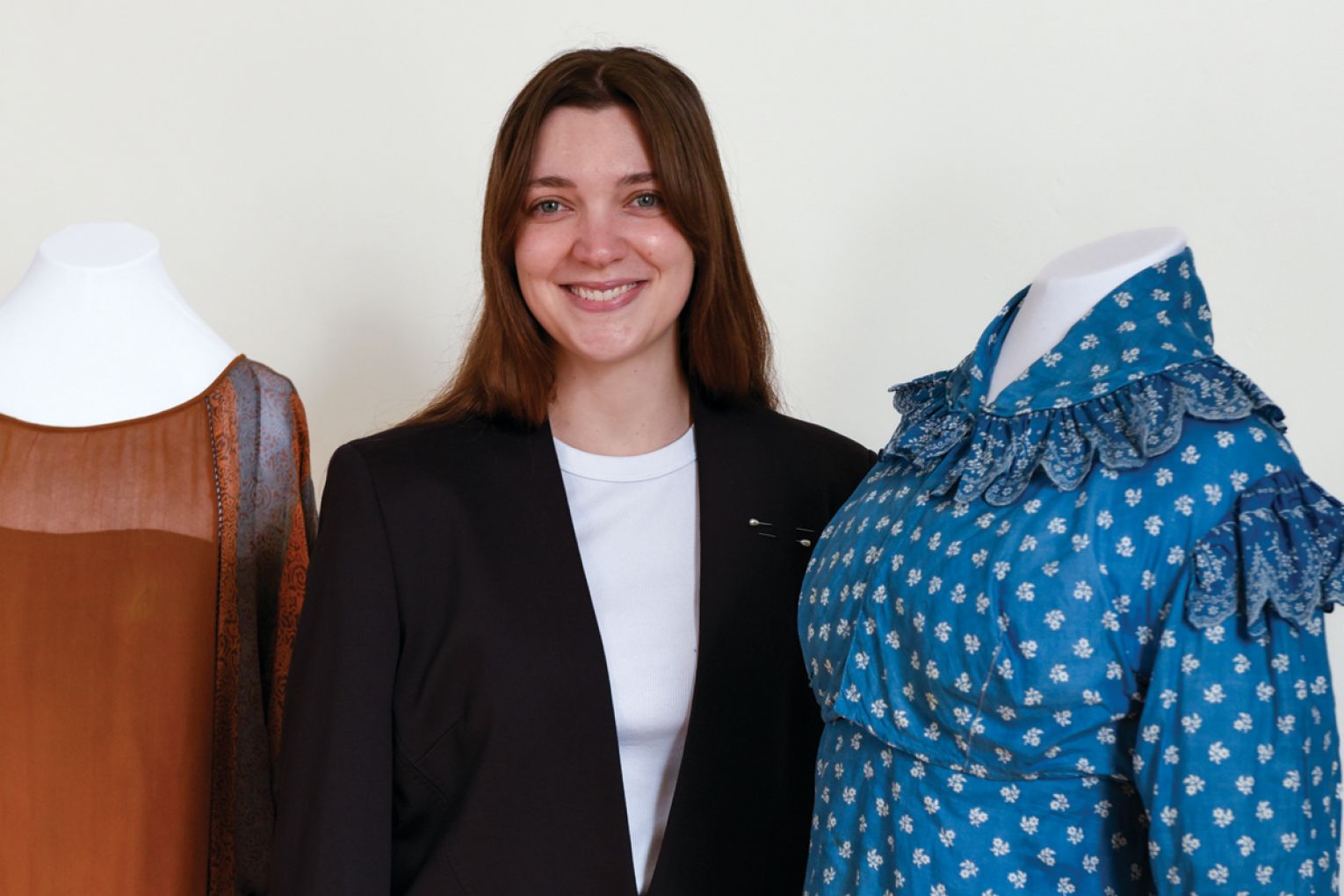 Kirby with two of the historic dresses that were put on display.