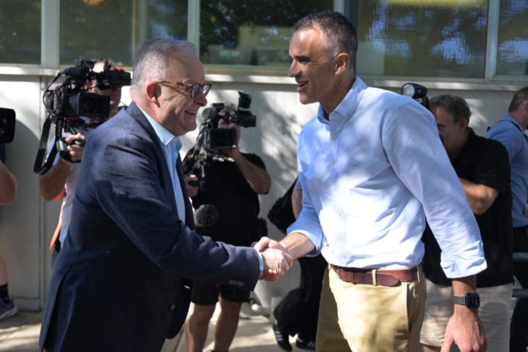 Prime Minister Anthony Albanese lends a hand at the polling booths this morning with Labor Leader Peter Malinauskas. Picture: Facebook