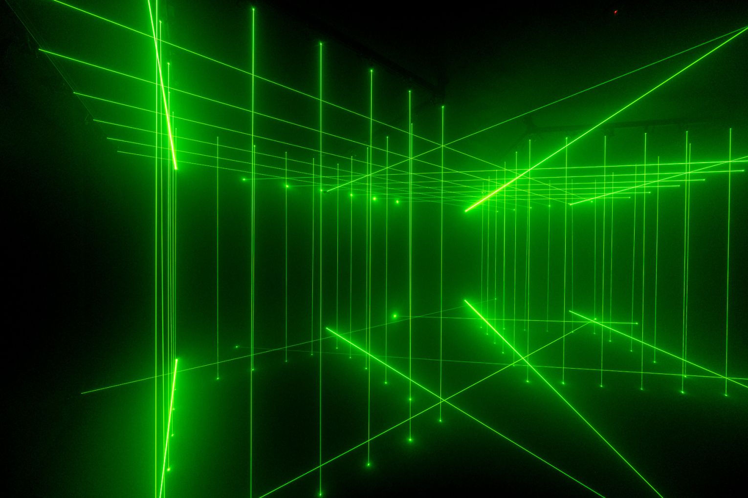 Li Hui, Cage 2006-2014, green iodide lasers, fog machine. Image courtesy of the Artist and the White Rabbit Collection, Sydney