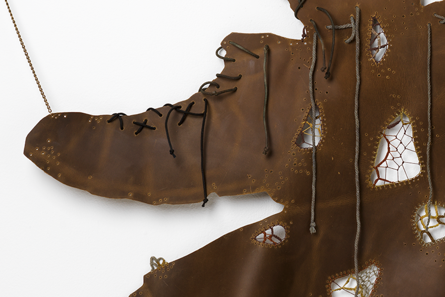 Sera Waters, Stash and Haul - Underground legwork (many) (detail), 2025-26, leather, cotton and various threads, chain, hand-dyed shoelaces, rope, 145 x 110 cm. Photo: Grant Hancock / Supplied
