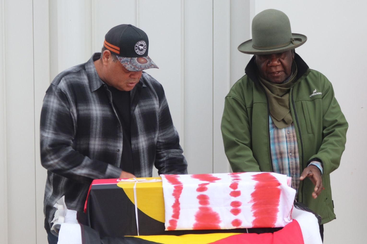 Raymond Finn and Dion Bromley with the remains of Thomas Cowell. Photo: Charlie Gilchrist/InDaily