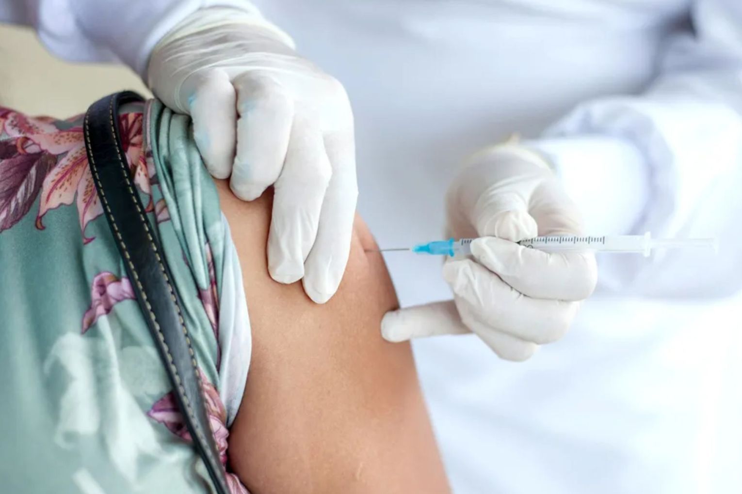 A drop in vaccinations has been blamed for the widespread outbreak of a respiratory disease.