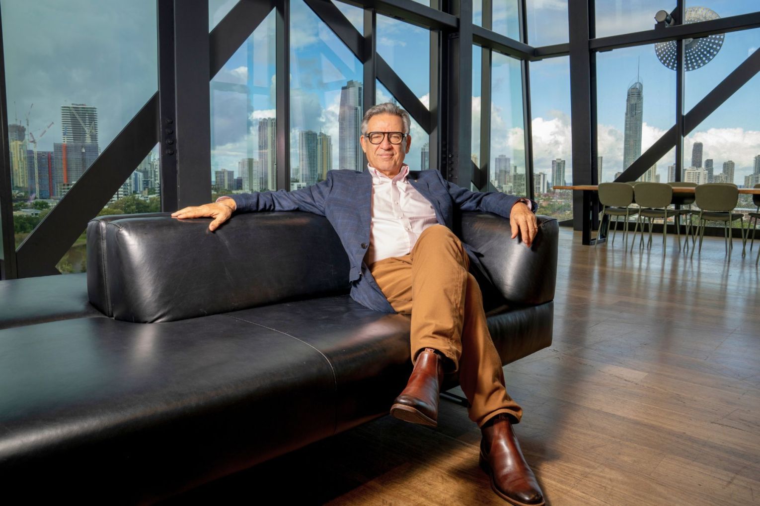 He couldn't look more relaxed if he tried ... former QPAC boss John Kotzas is loving his new gig on the Gold Coast. Photo: Tait Whitelaw, Experience Gold Coast