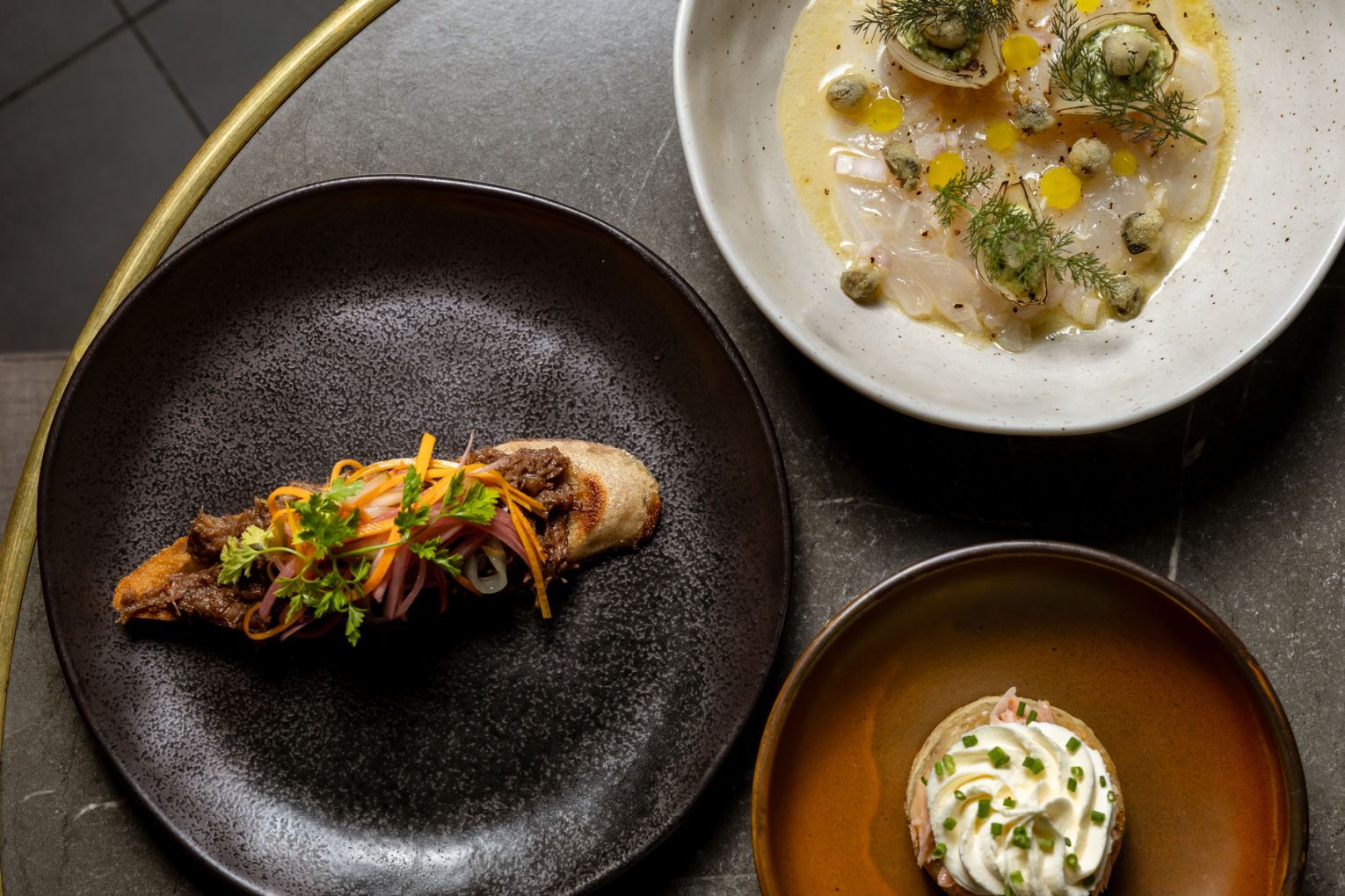 Slow-braised beef cheek and house pickles on toast | Credit: James Frostick
