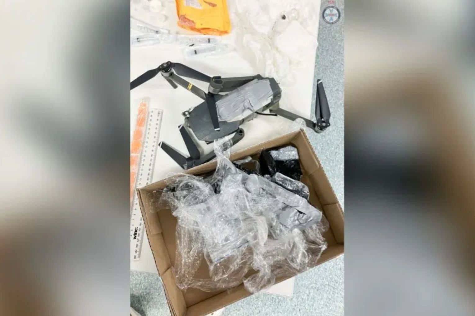 A man has been charged after a drone allegedly carried drugs, a glass pipe and a phone into prison.