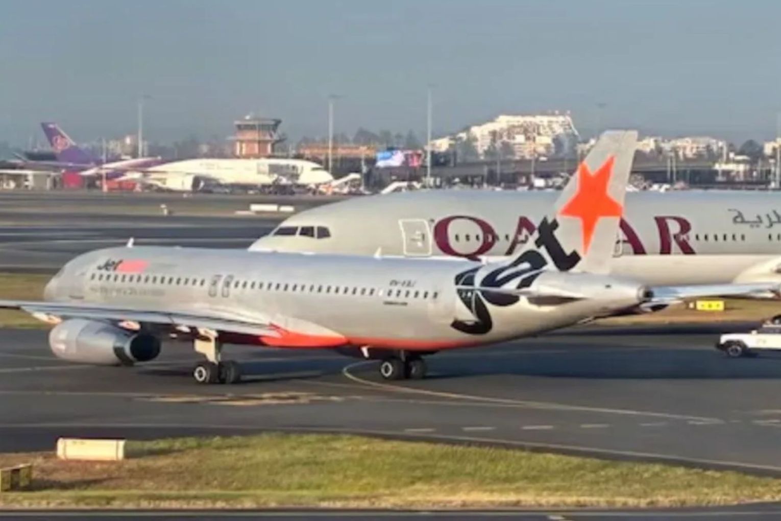 A Jetstar plane has been involved in a near-miss with a Qatar plane on the tarmac at Sydney Airport. 