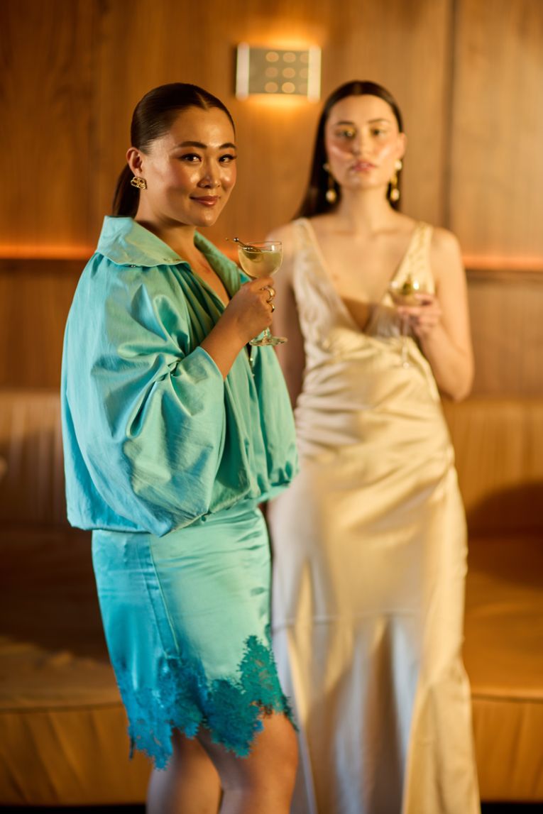 Nini Wang wears the 23 Reversible Jacket, with details like a makeup guard in the high-neck — Nini says this one’s “for the girls”.