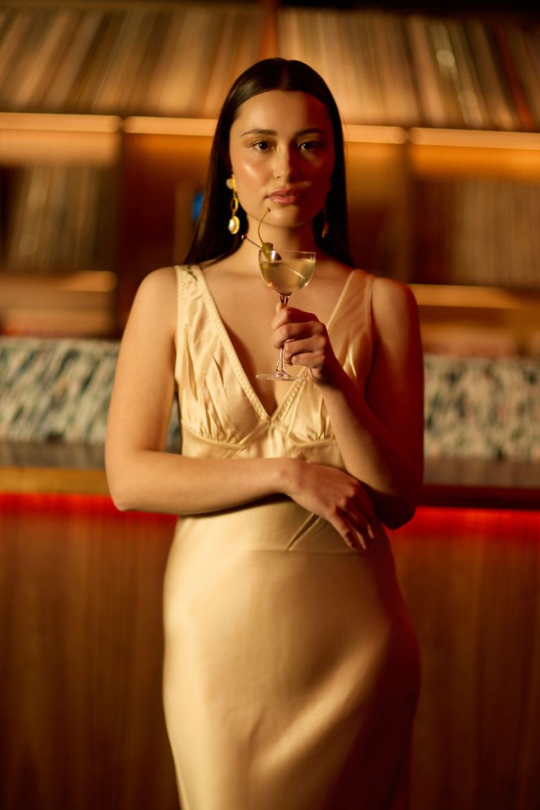 Lara Williams wears the Infatuated Silk Maxi Dress from 23rd August, with Élever Australia’s Florence Earrings, hair by Clip Joint Salons and Media Makeup.