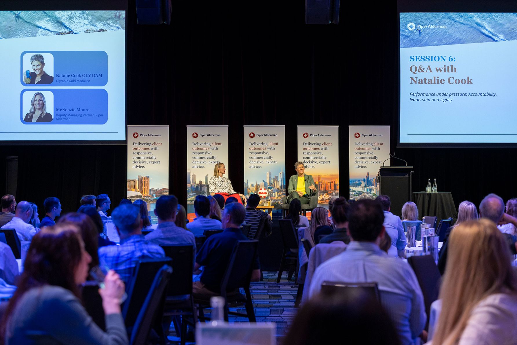 Deputy Managing Partner, McKenzie Moore and Olympic Gold Medallist, Natalie Cook on stage.