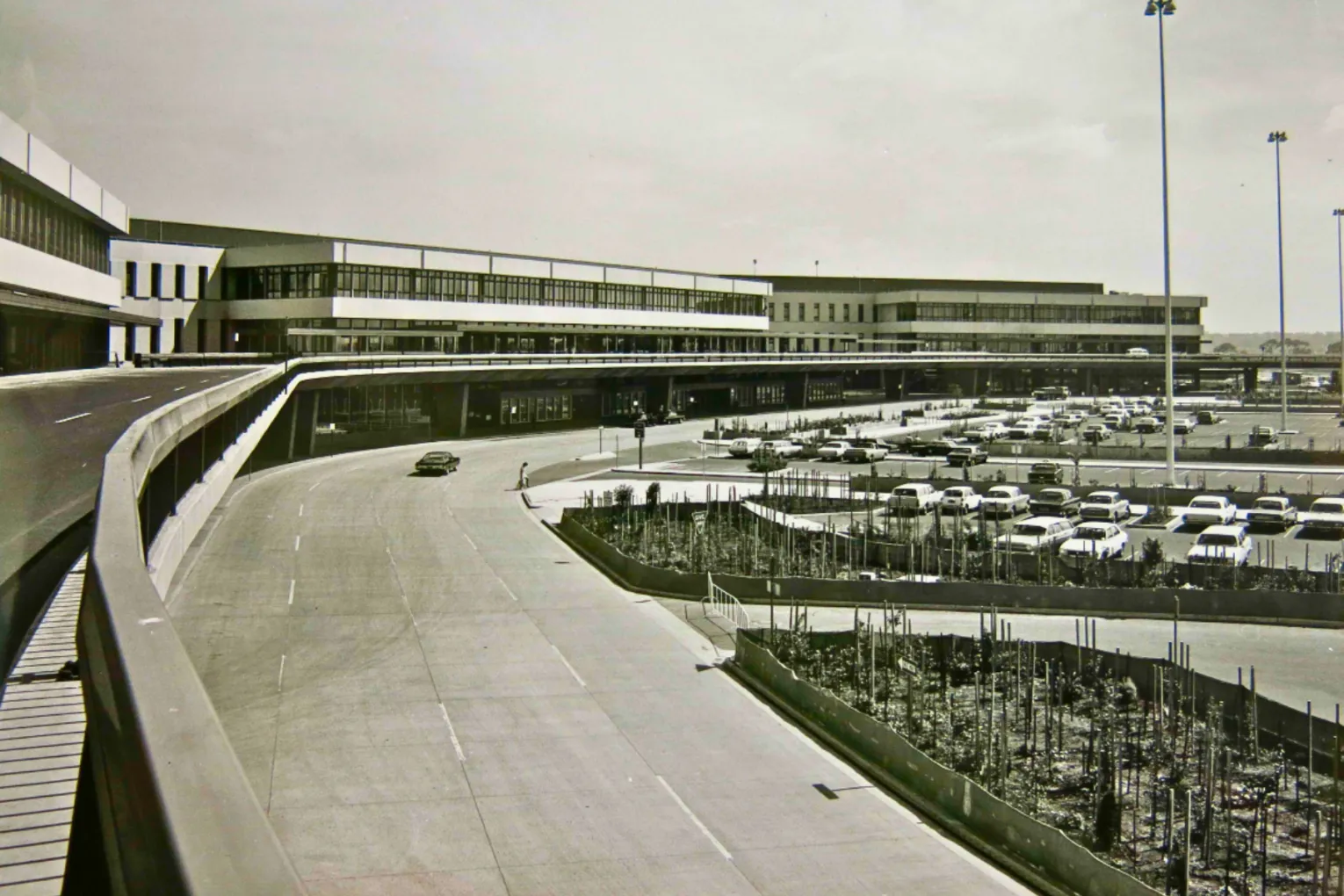 Tullamarine's elevated road with minimalist brutalist terminal buildings in 1970, pictured inside new book Melbourne Airport Tullamarine: A History. Photo: CAHS/CASA/Air Services
