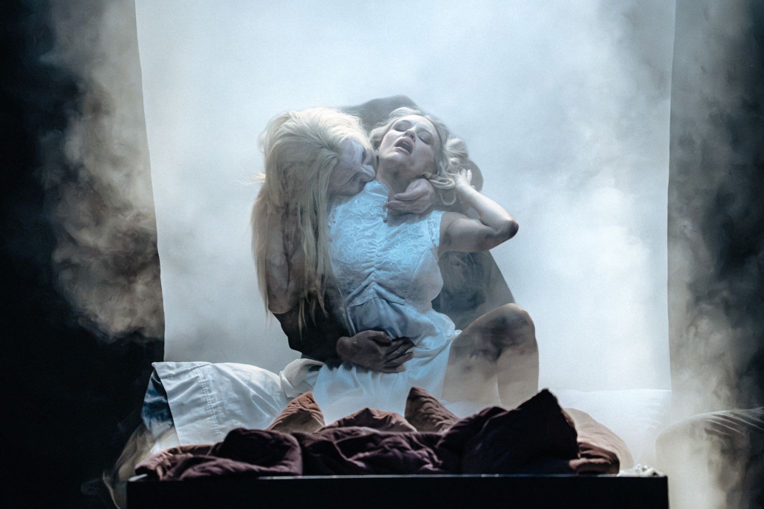 This won't hurt a bit! Dracula (Nick Skubij) feasting on Lucy (Jessica Vickers) in Dracula, now on at QPAC. Photo: Cameron Grant
