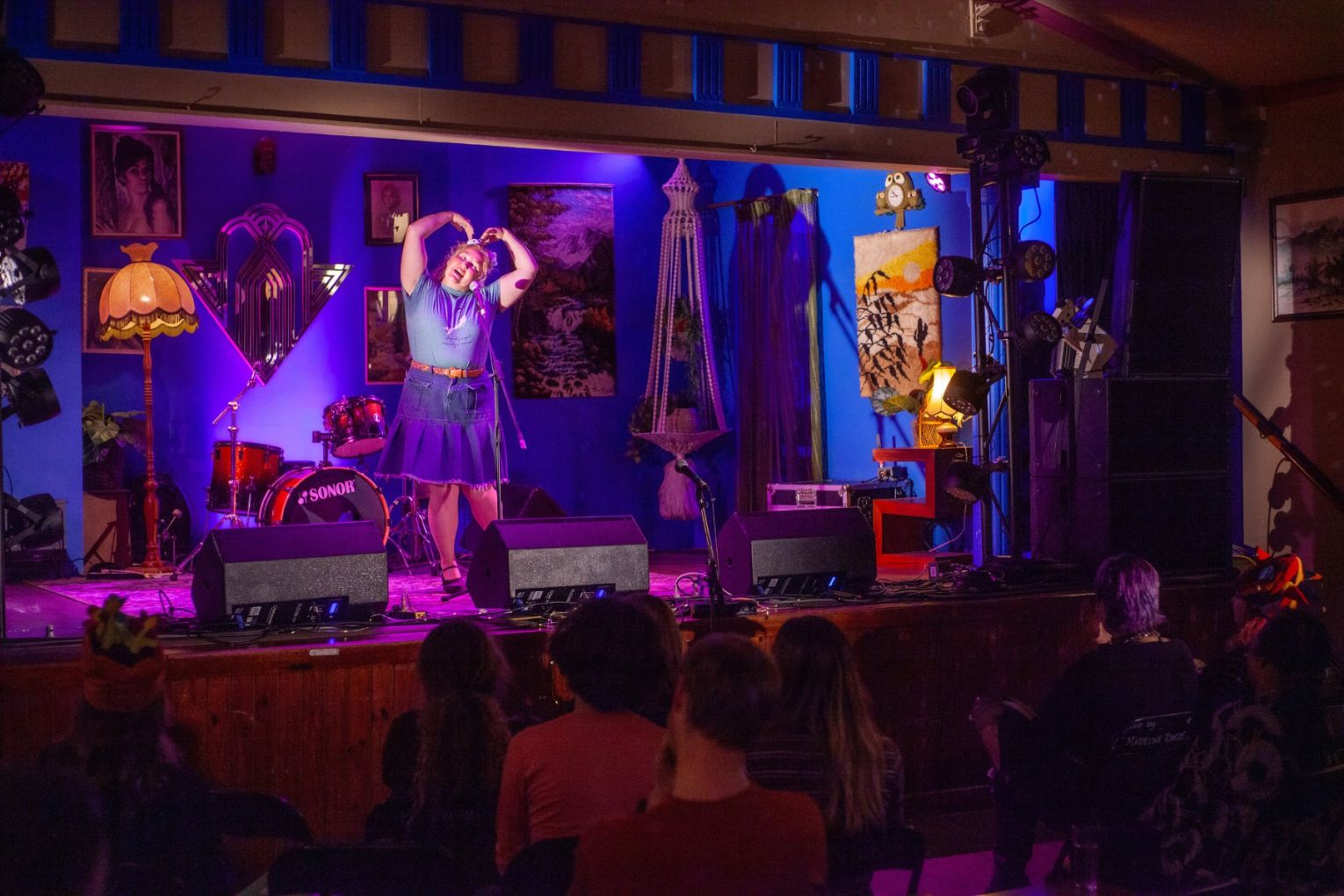 Ruckus slammer Kate performs a poem structured as a government message at the September Ruckus Slam. Photo: Martin Ingle